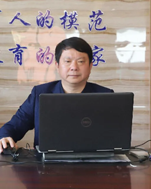 Yujun Chen, Principal of Yancheng Foreign Language School, at work